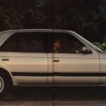Print advertisement for the 1987 MAZDA 929, side view of vehicle