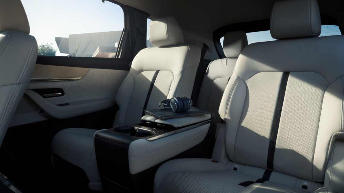Interior shot of 2025 Mazda CX-90, captain's chairs with white upholstery