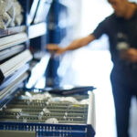 Service technician choosing parts from drawers